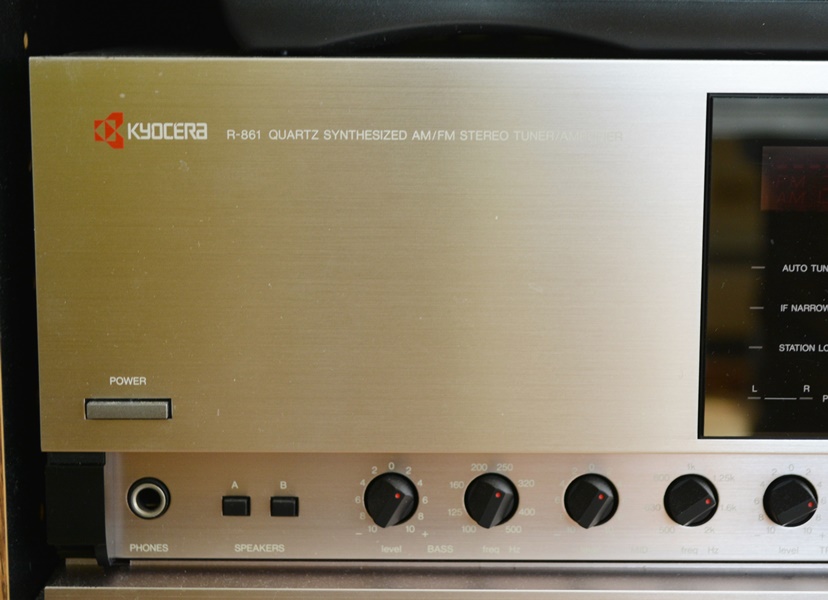 Kyocera Stereo System, Panasonic VHS/DVD and Laminate Cabinet