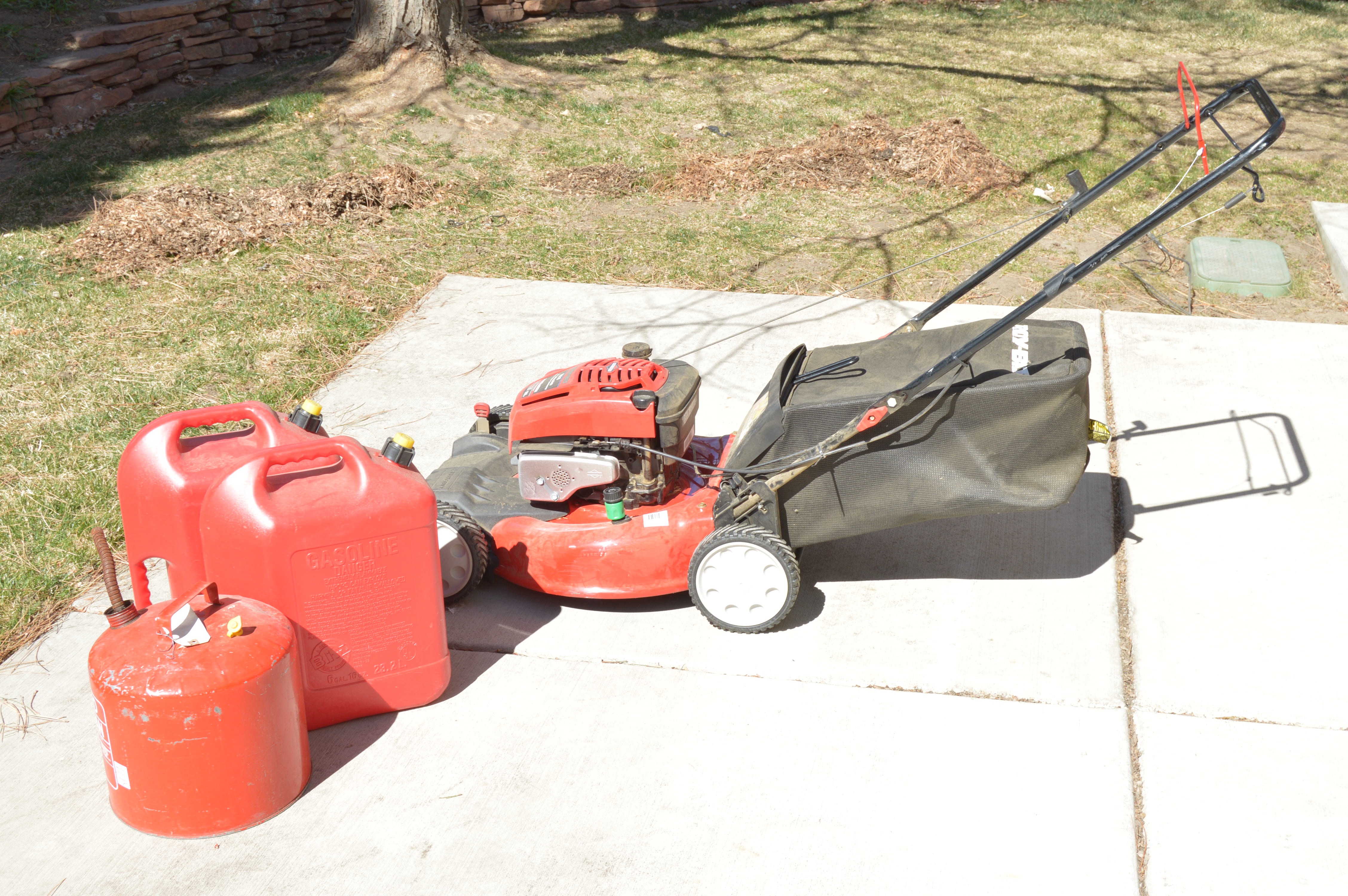 Troy Bilt Lawn Mower and Gas Cans
