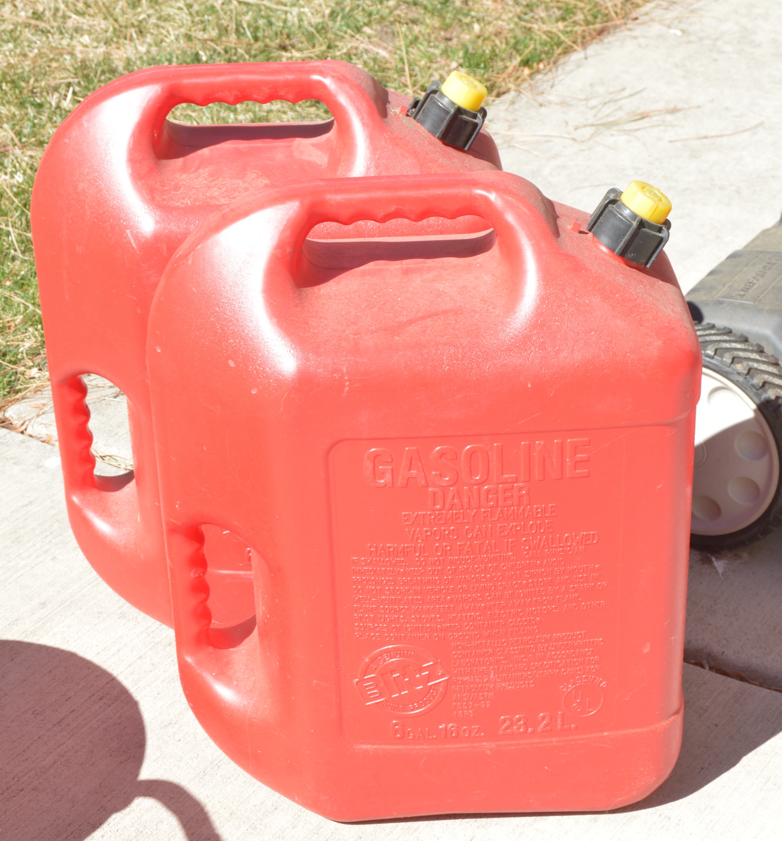 Troy Bilt Lawn Mower and Gas Cans