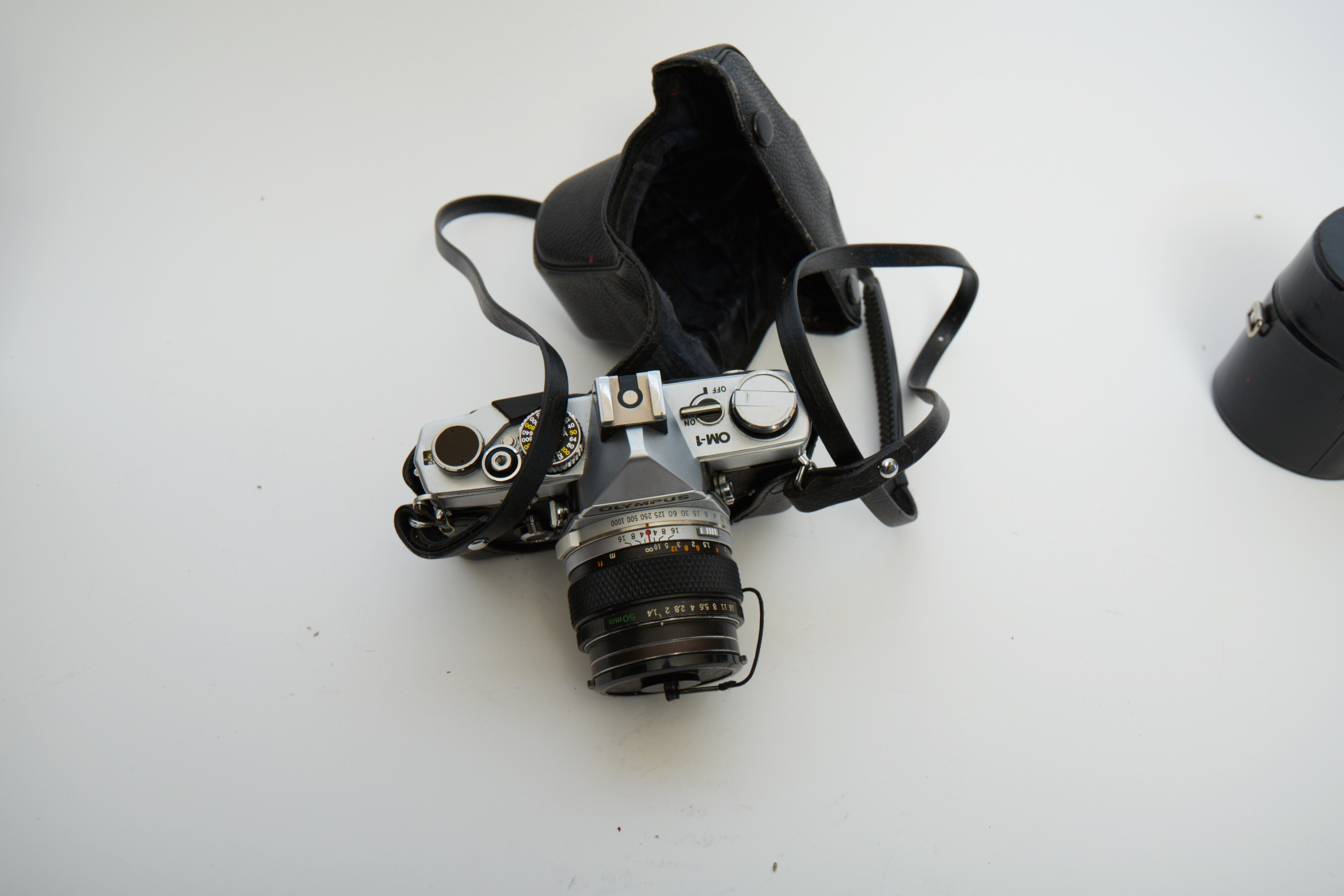 Vintage Olympus OM-1 SLR Camera with Three Lenses