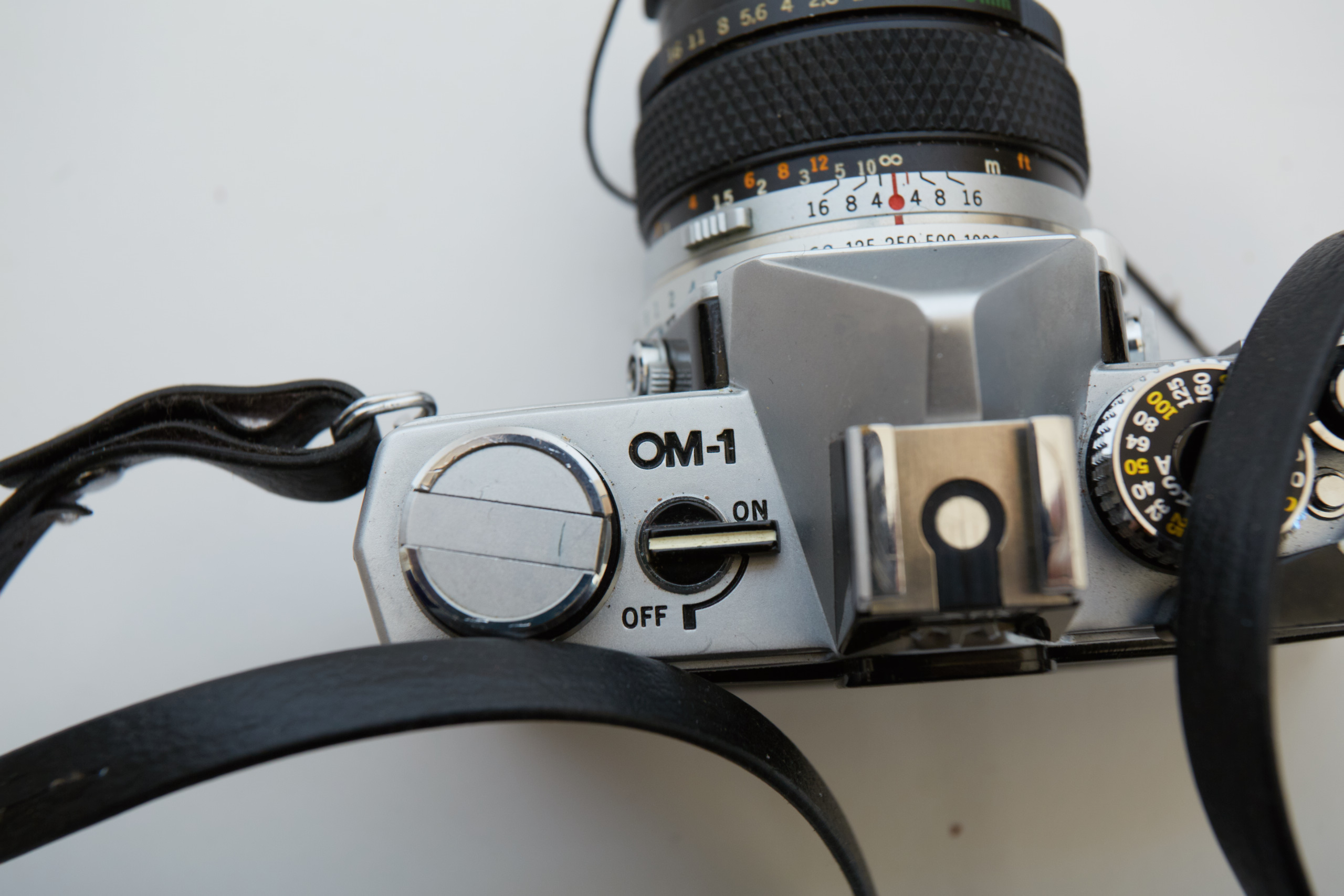 Vintage Olympus OM-1 SLR Camera with Three Lenses