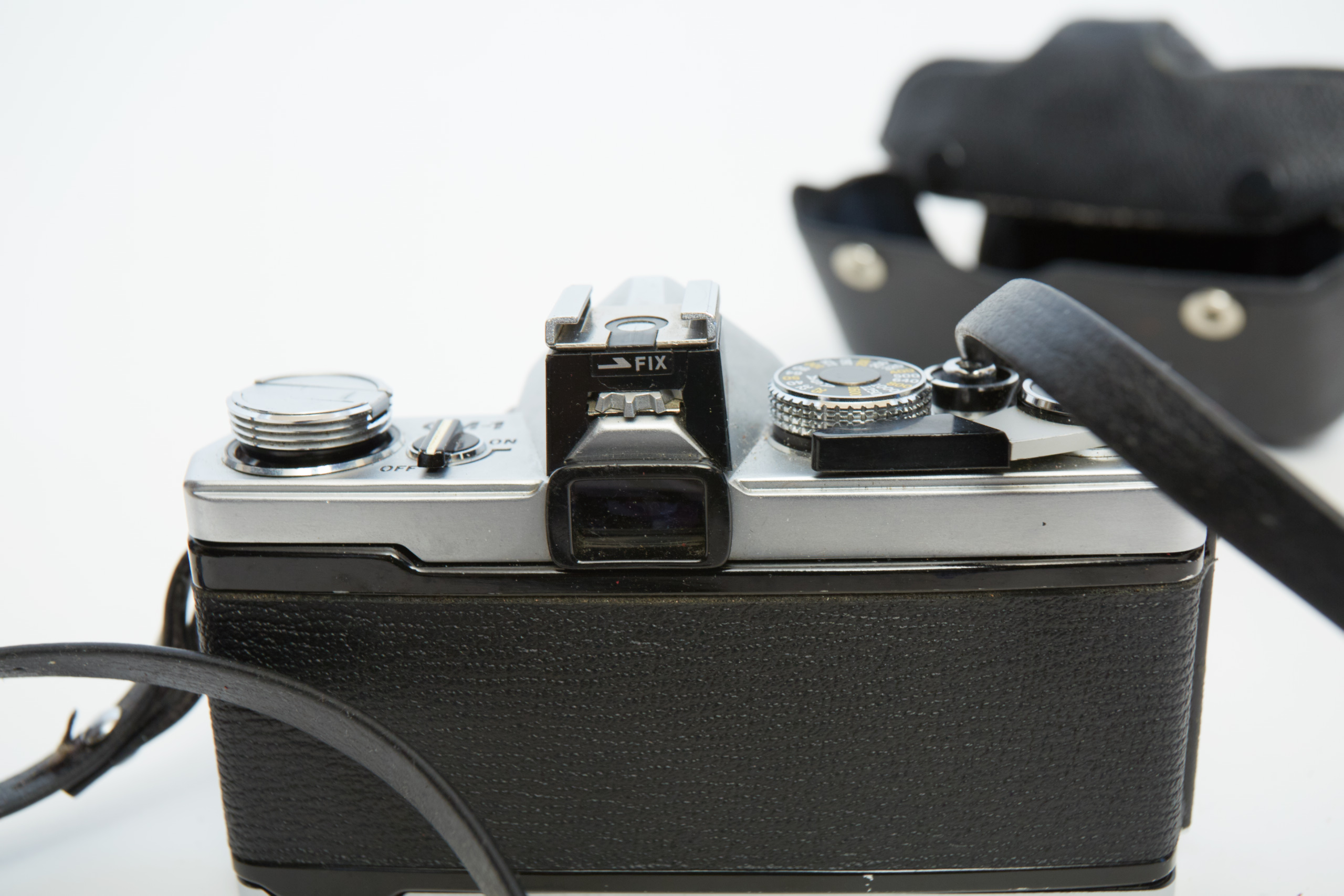 Vintage Olympus OM-1 SLR Camera with Three Lenses