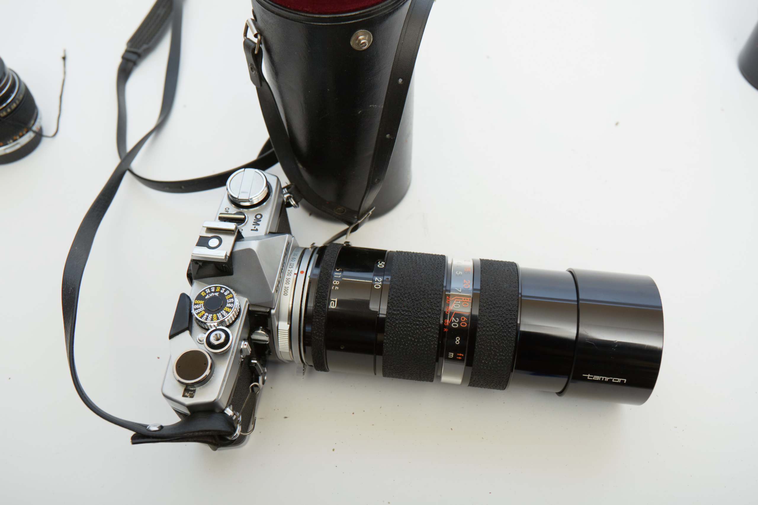 Vintage Olympus OM-1 SLR Camera with Three Lenses