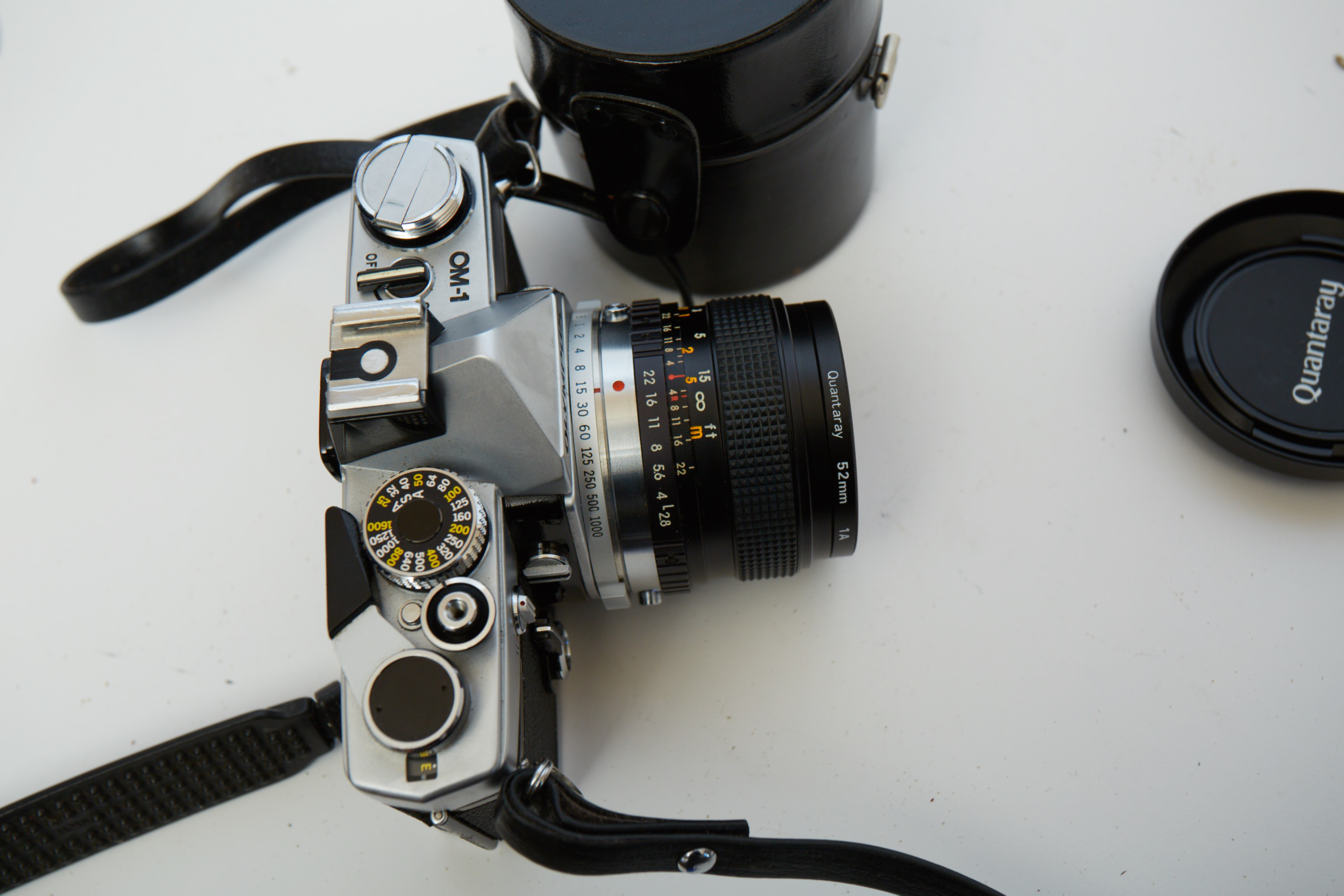 Vintage Olympus OM-1 SLR Camera with Three Lenses