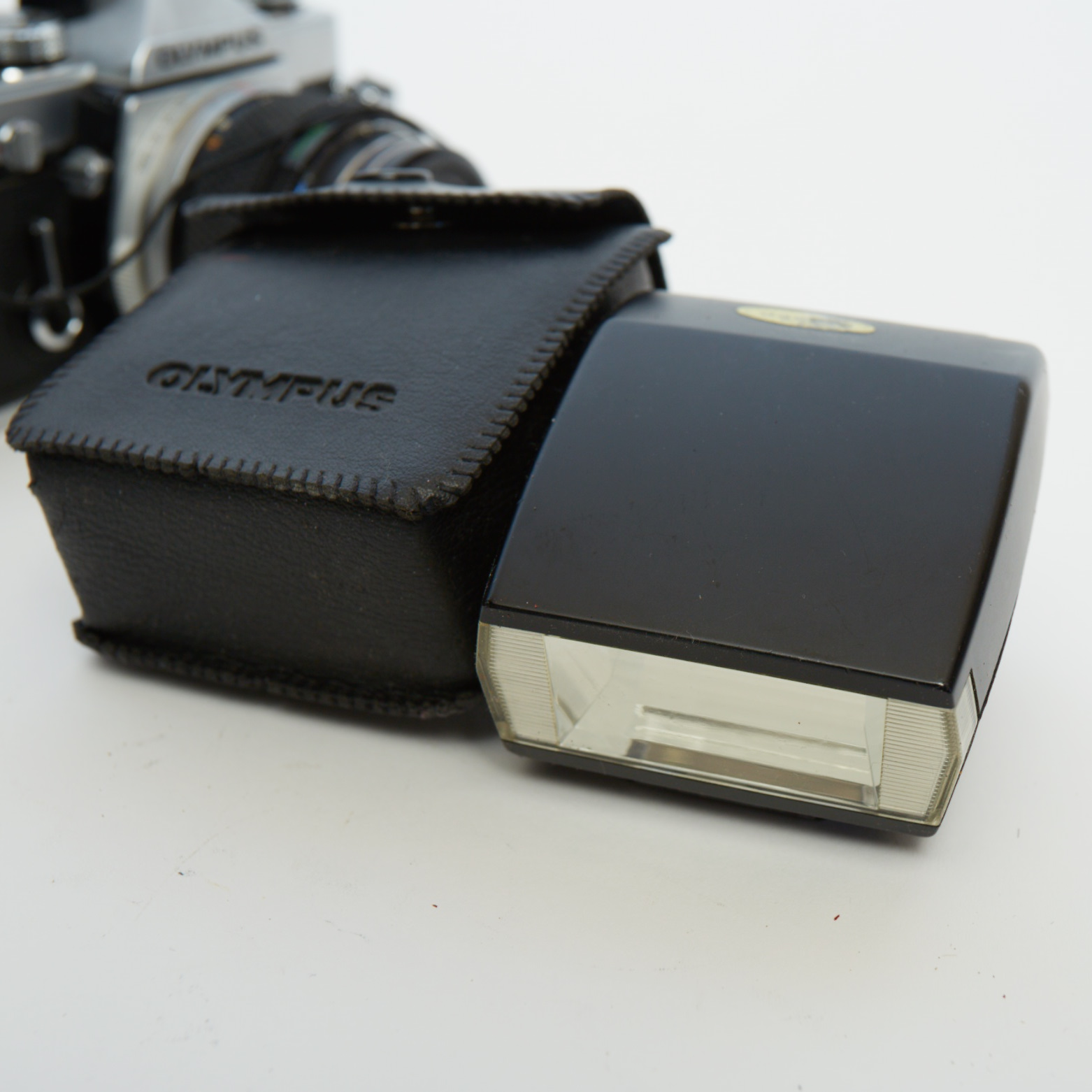 Vintage Olympus OM-1 SLR Camera with Three Lenses