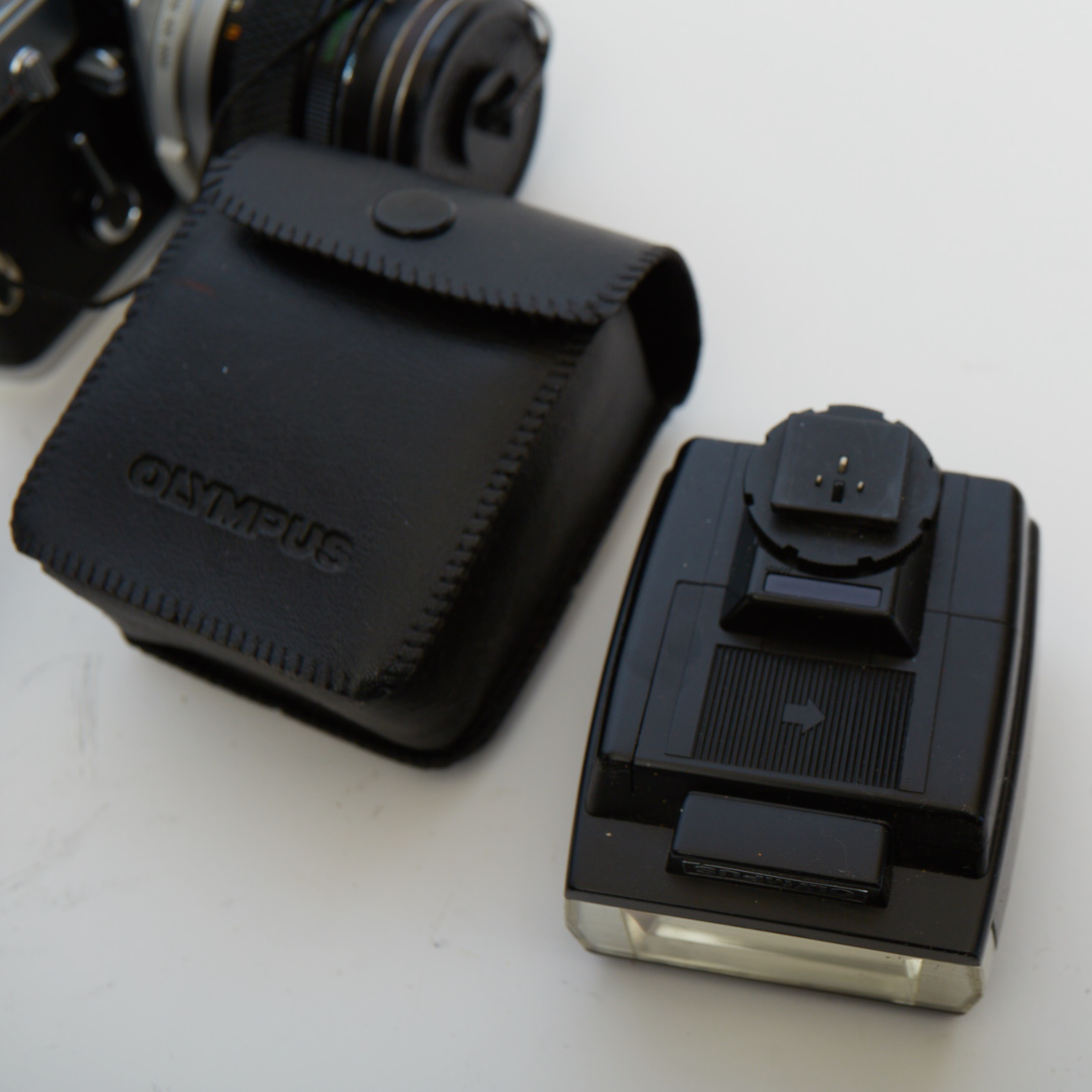 Vintage Olympus OM-1 SLR Camera with Three Lenses