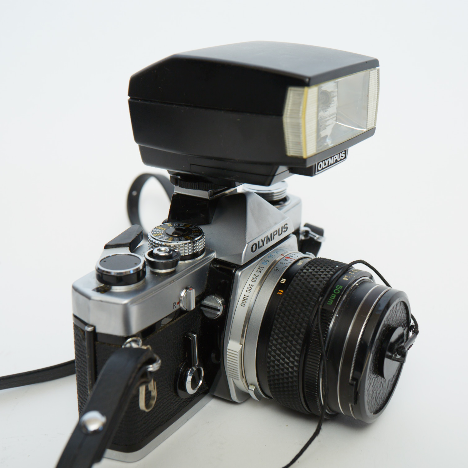 Vintage Olympus OM-1 SLR Camera with Three Lenses