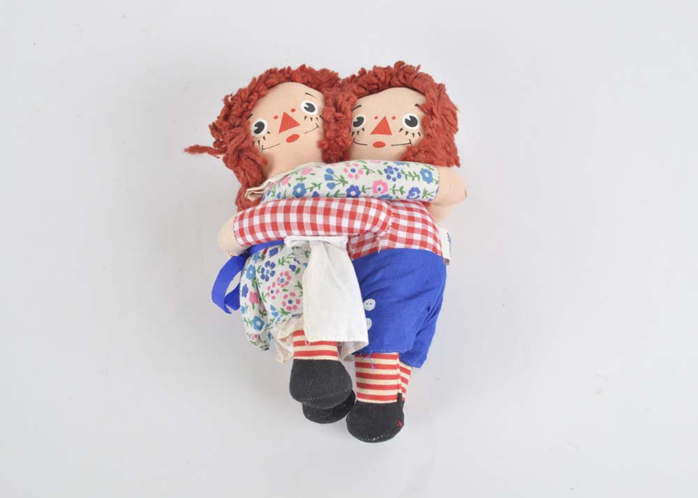 Embracing Raggedy Ann and Andy