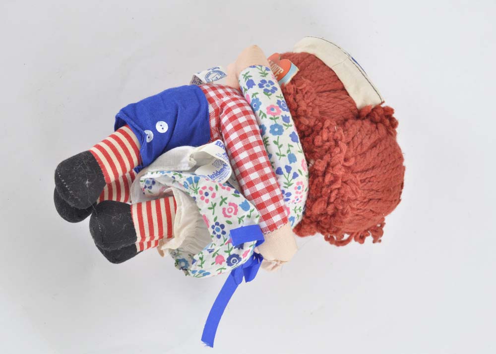 Embracing Raggedy Ann and Andy