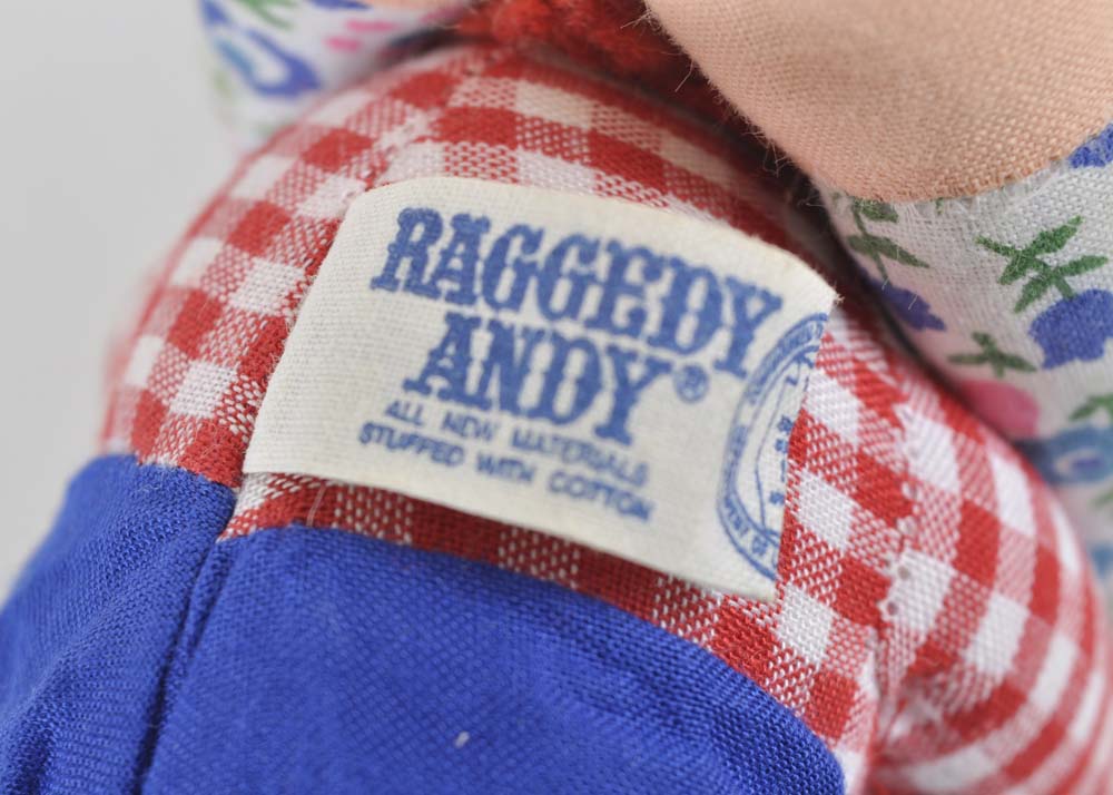 Embracing Raggedy Ann and Andy