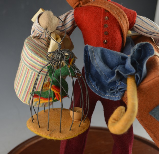 Cloth Traveler Figurine Under A Glass Cloche