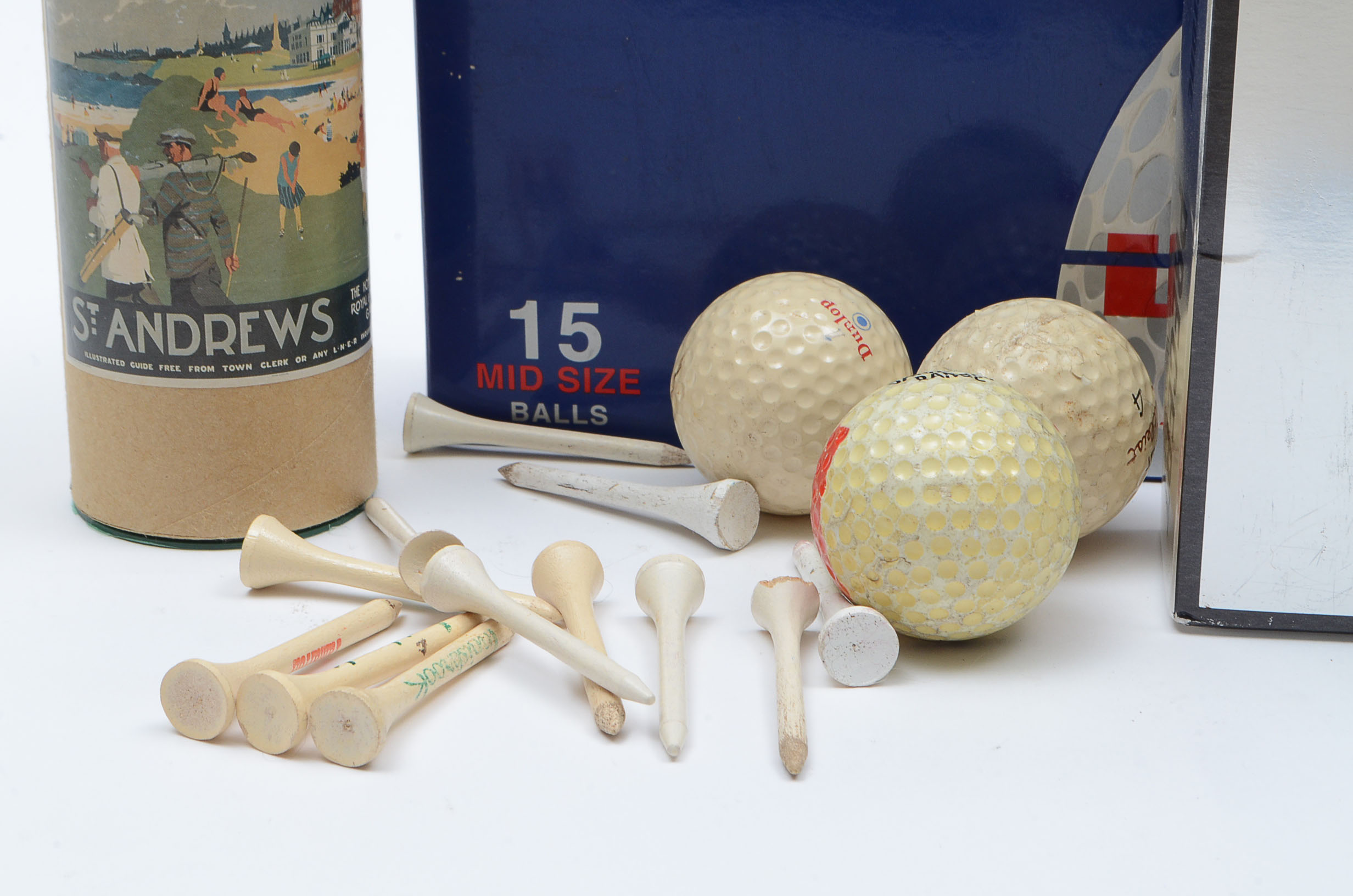 Assortment of Golf Balls and Tees