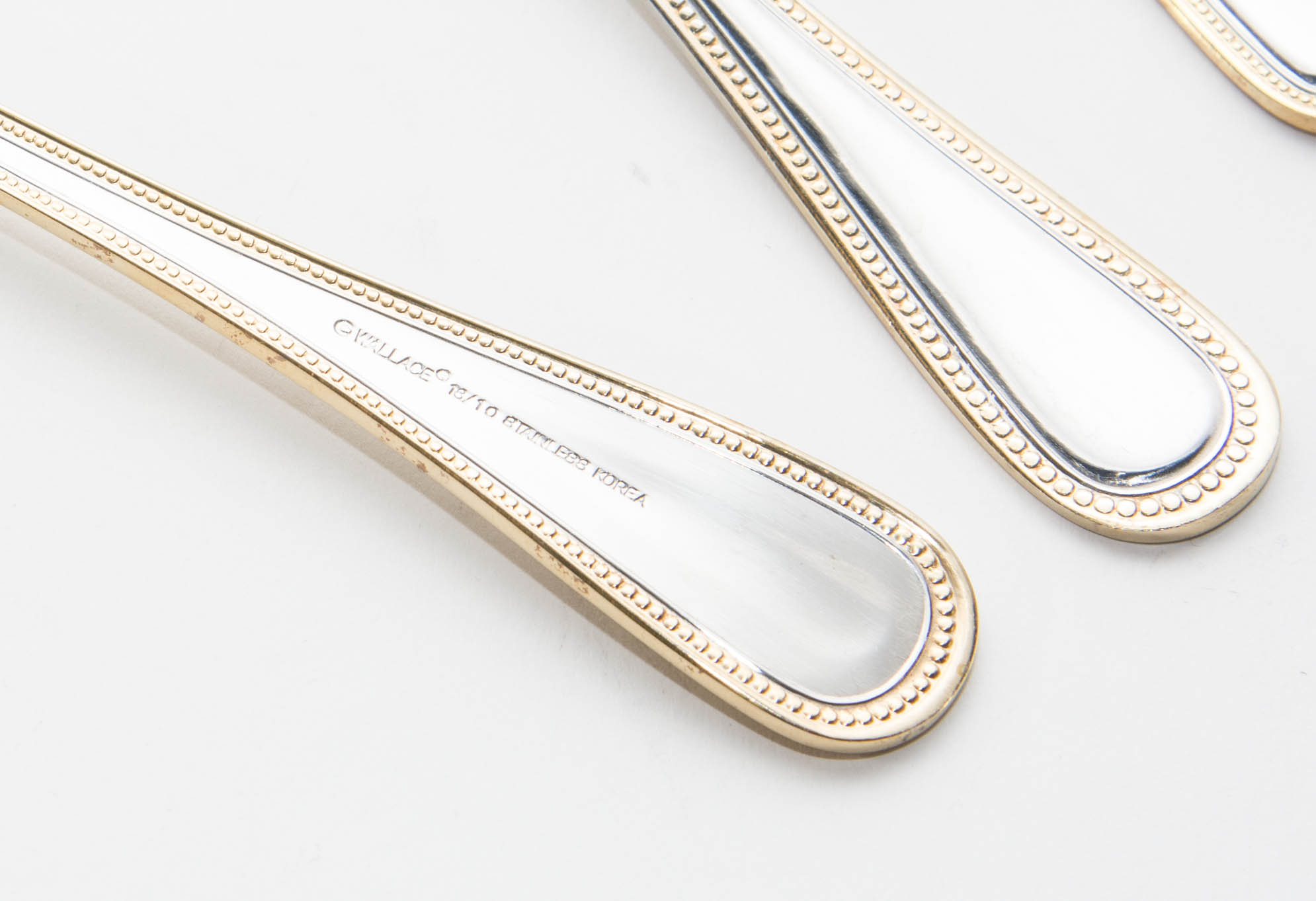 Wallace Stainless Steel and Gold 64 piece Flatware Service for 12 in the Gold Royal Bead Pattern