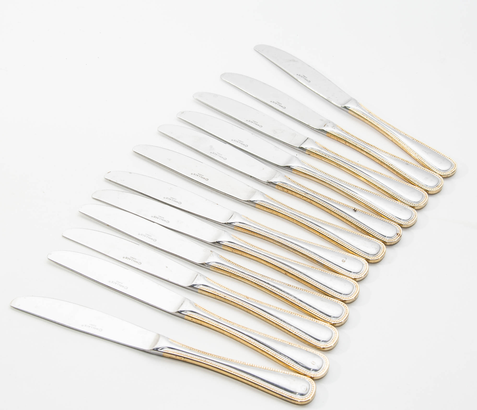 Wallace Stainless Steel and Gold 64 piece Flatware Service for 12 in the Gold Royal Bead Pattern