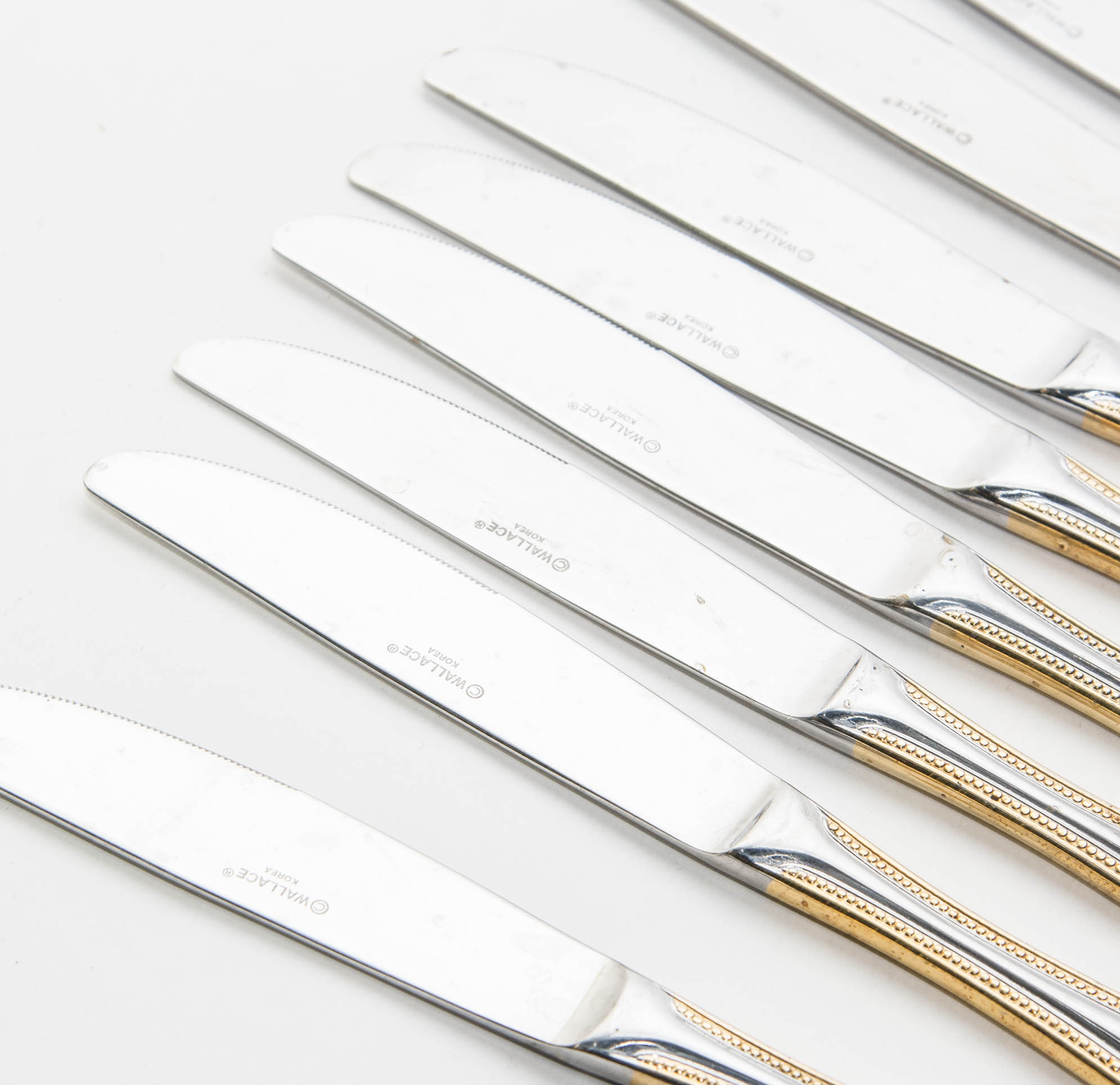Wallace Stainless Steel and Gold 64 piece Flatware Service for 12 in the Gold Royal Bead Pattern