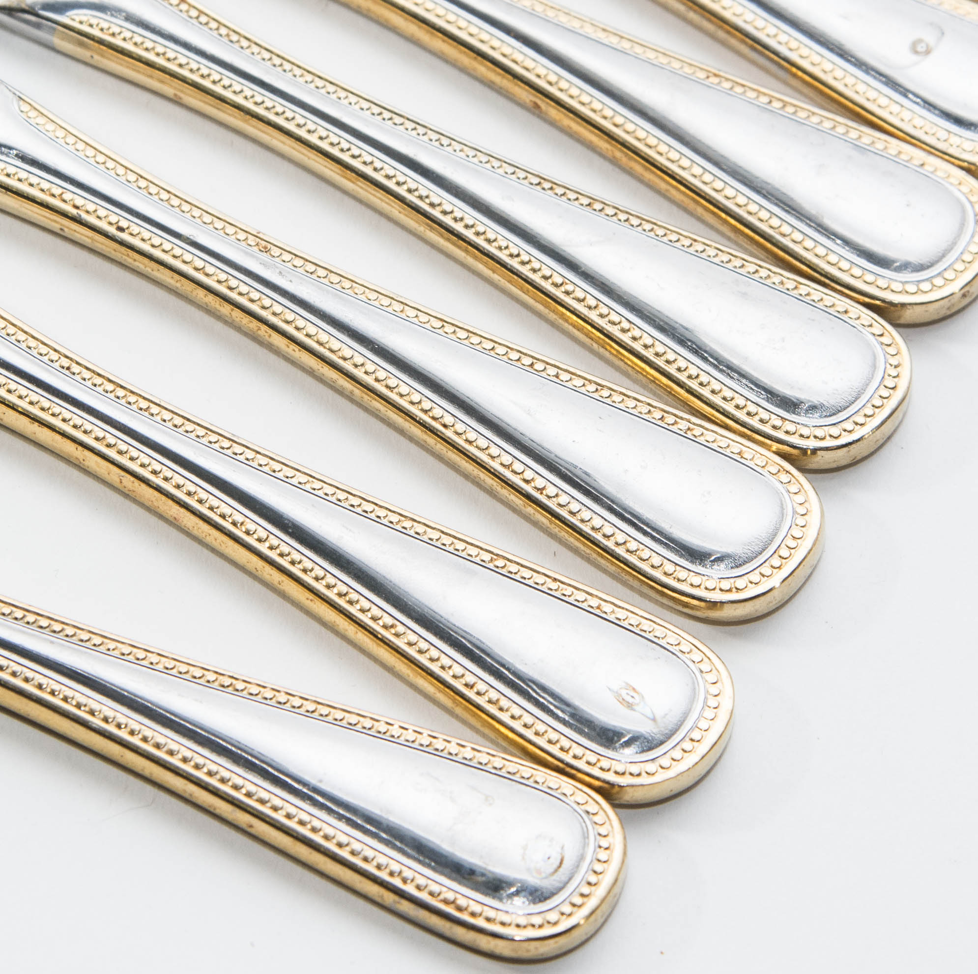 Wallace Stainless Steel and Gold 64 piece Flatware Service for 12 in the Gold Royal Bead Pattern