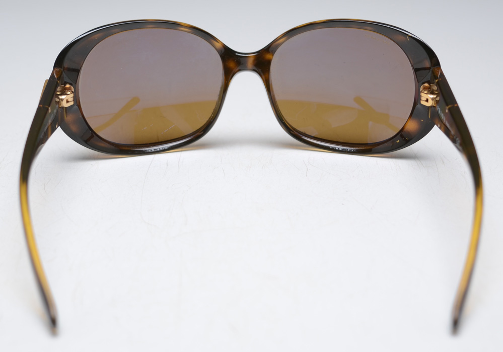 Pair of Prada Designer Polarized Sunglasses