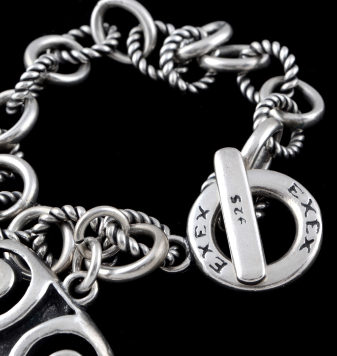 Group of Sterling Silver Jewelry Including an Exix Link Bracelet
