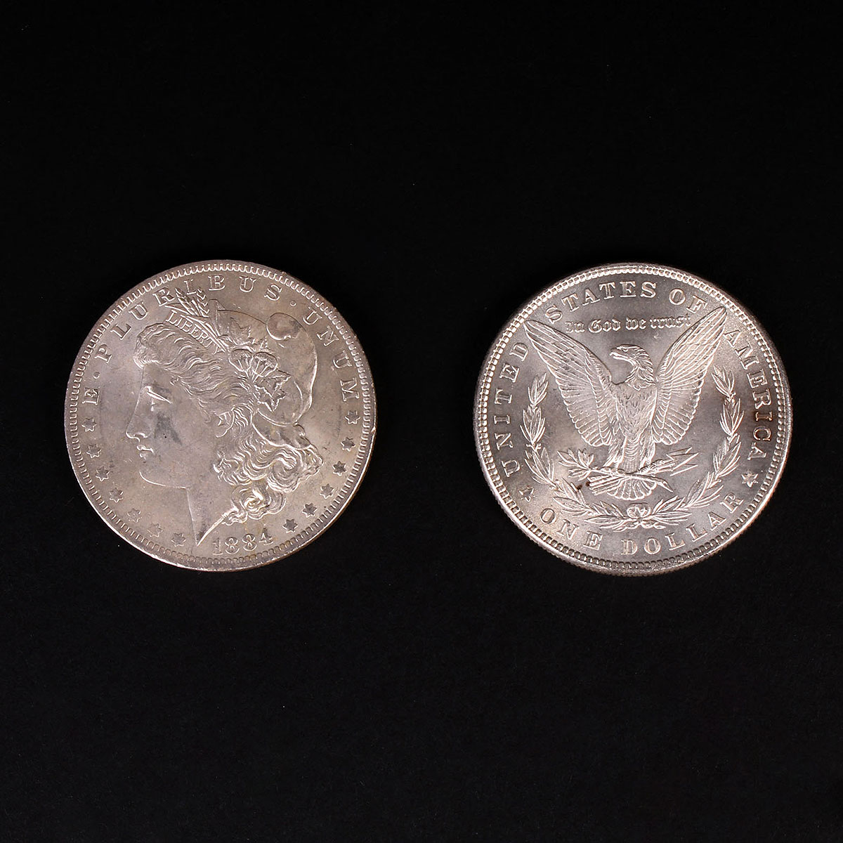 Two 1884 Morgan Silver Dollars