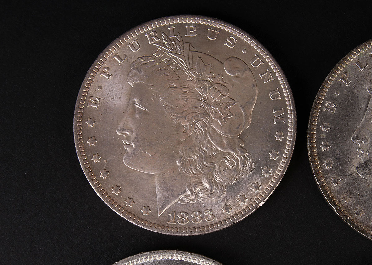 Four 1883-O Morgan Silver Dollars
