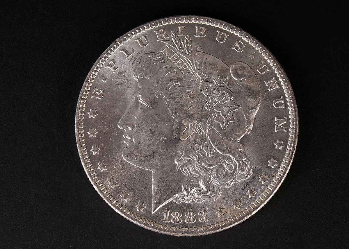 Four 1883-O Morgan Silver Dollars