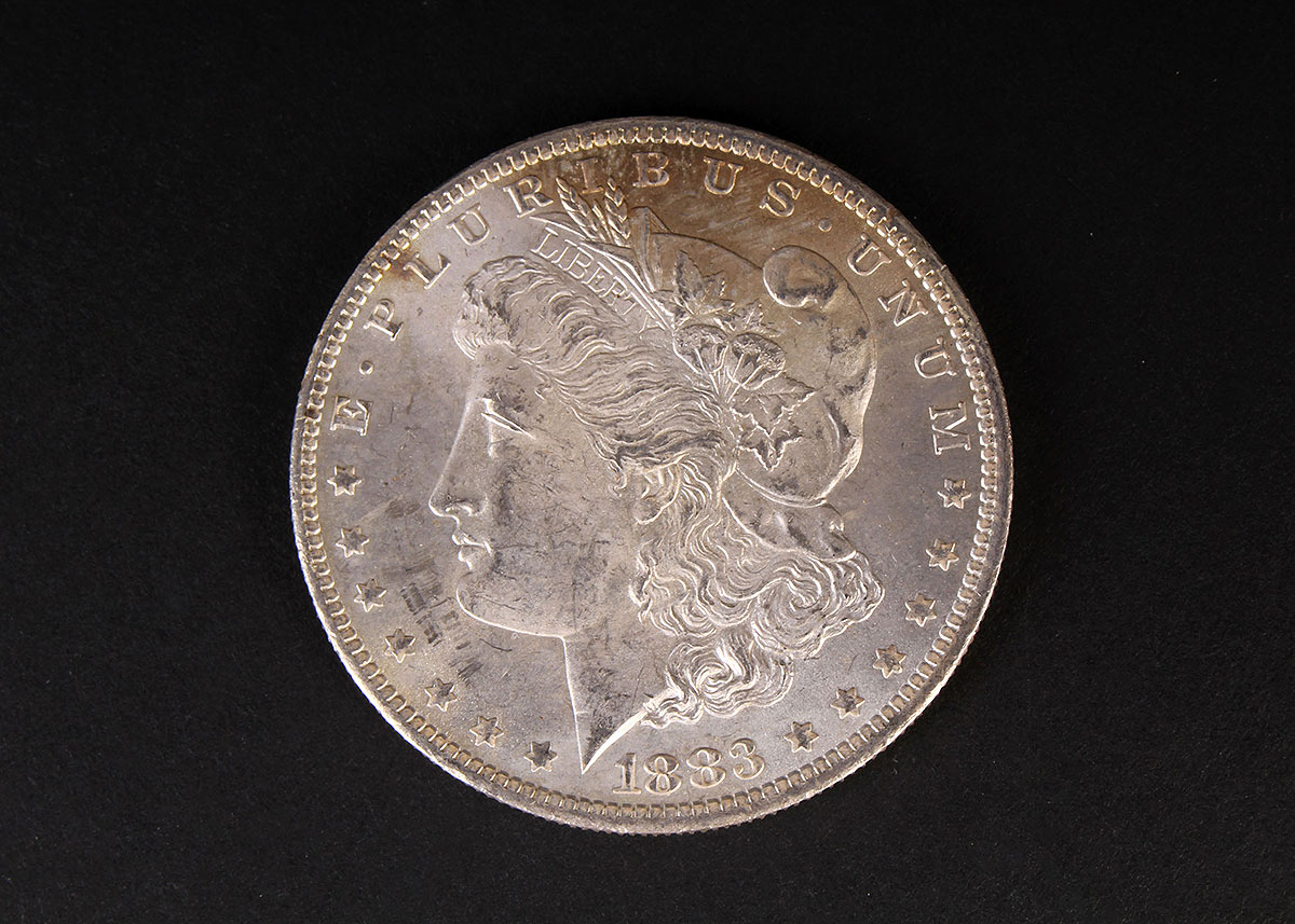 Four 1883-O Morgan Silver Dollars