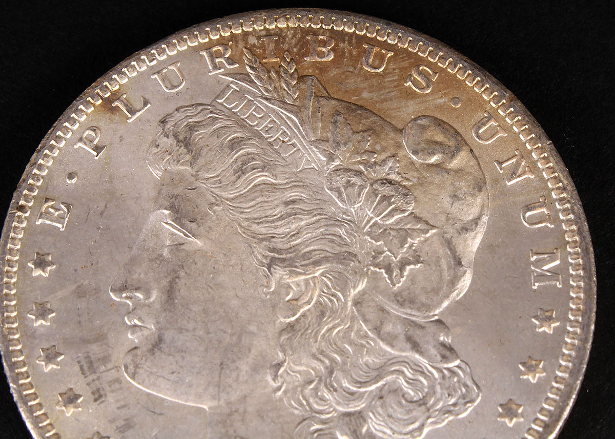 Four 1883-O Morgan Silver Dollars