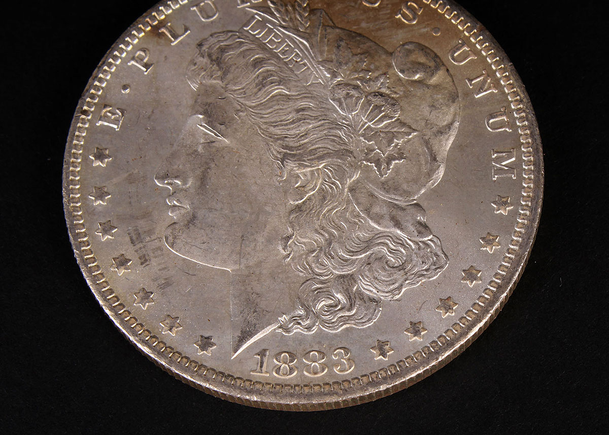 Four 1883-O Morgan Silver Dollars