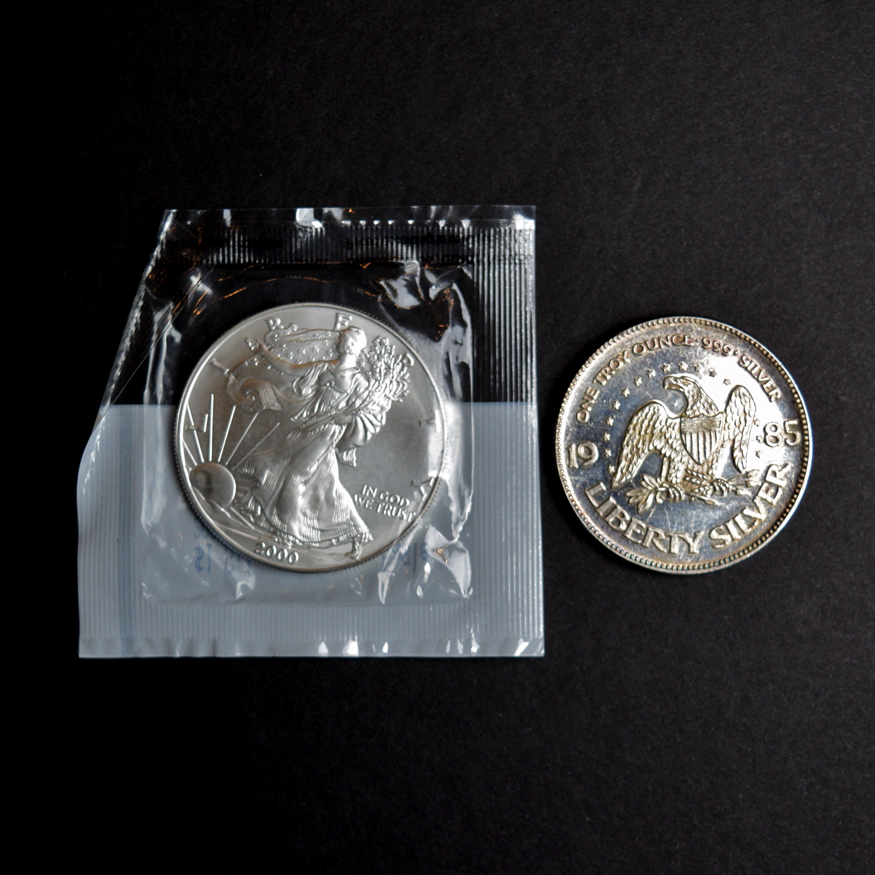 2000 P Walking Liberty Dollar and 1985 Life Liberty Happiness Silver Coin