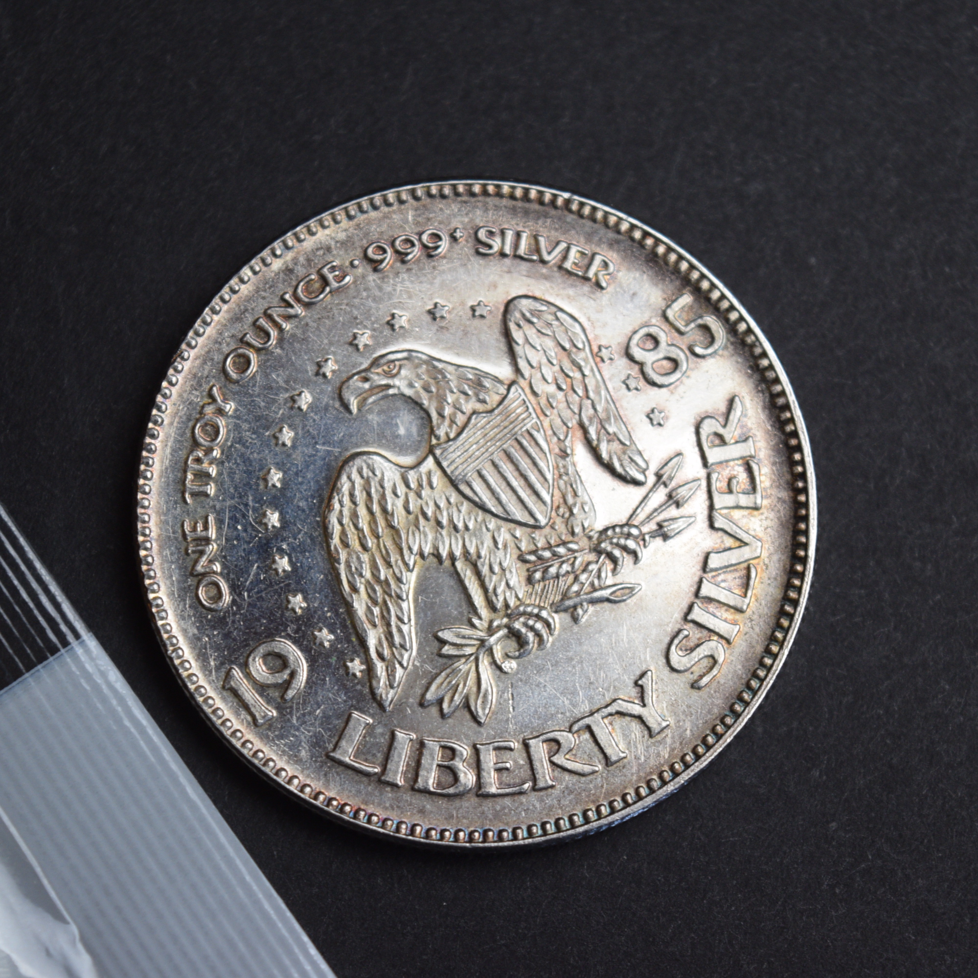 2000 P Walking Liberty Dollar and 1985 Life Liberty Happiness Silver Coin