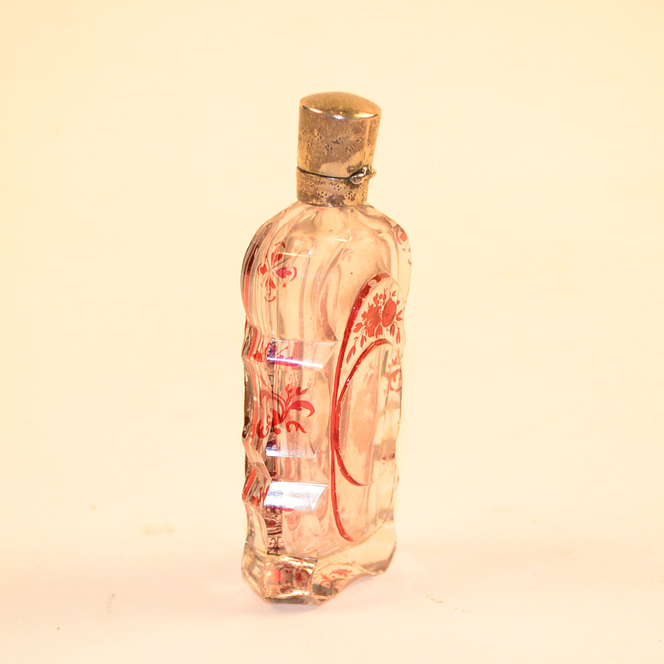 Antique Glass Perfume Bottle with Red Accents and Metal Cap