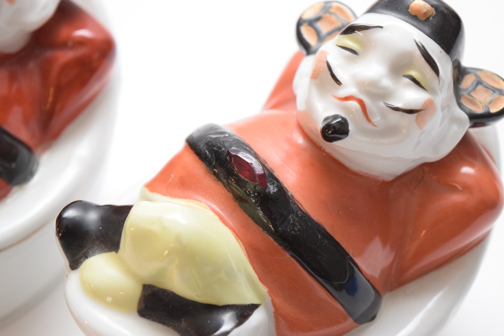 Pair of Porcelain Asian Inspired Men At Rest Figurines