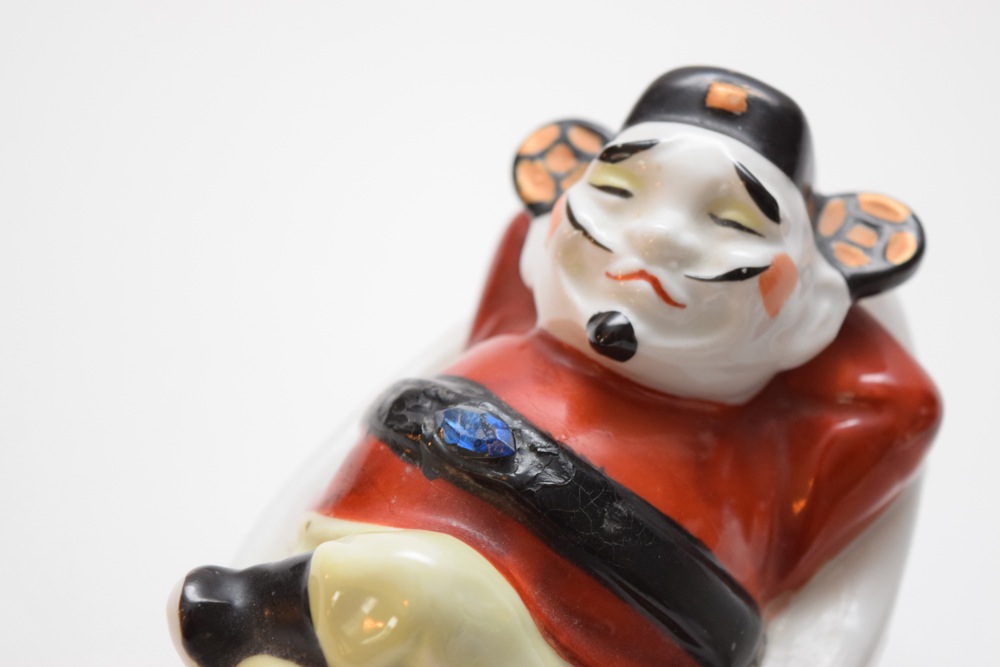 Pair of Porcelain Asian Inspired Men At Rest Figurines