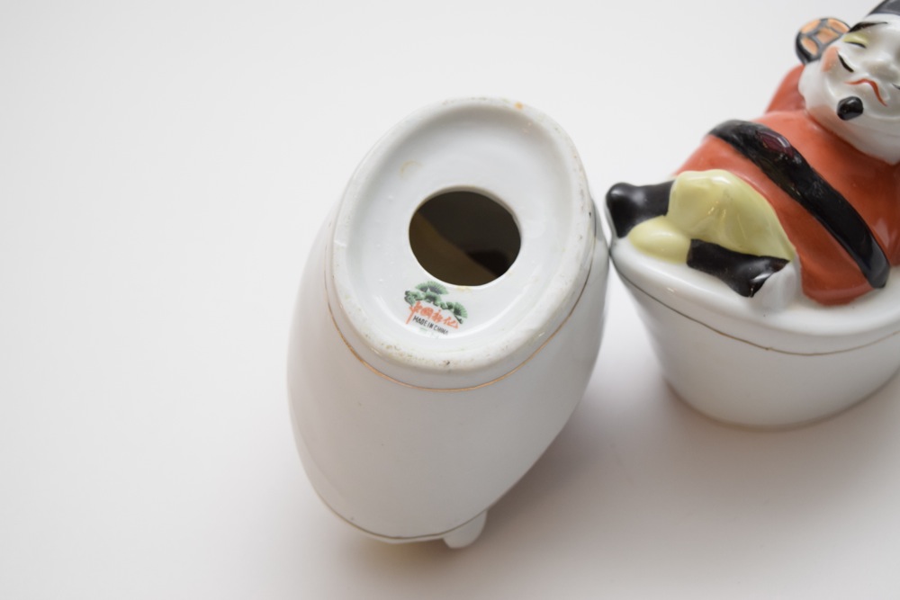 Pair of Porcelain Asian Inspired Men At Rest Figurines