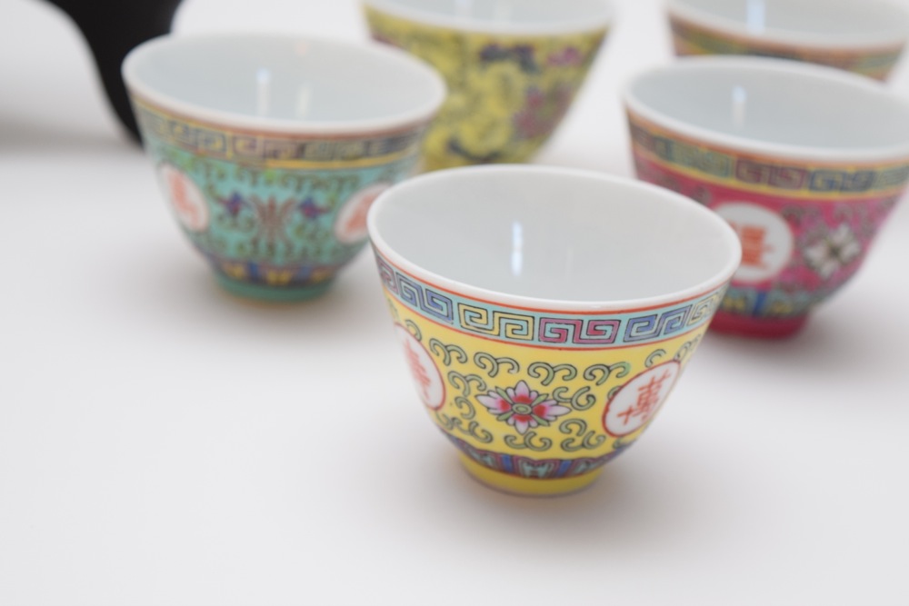Pair of Asian Inspired Porcelain Bowls and Four Sake Cups