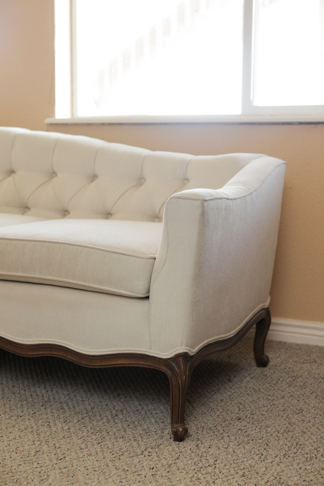 Upholstered Camel Back Sofa