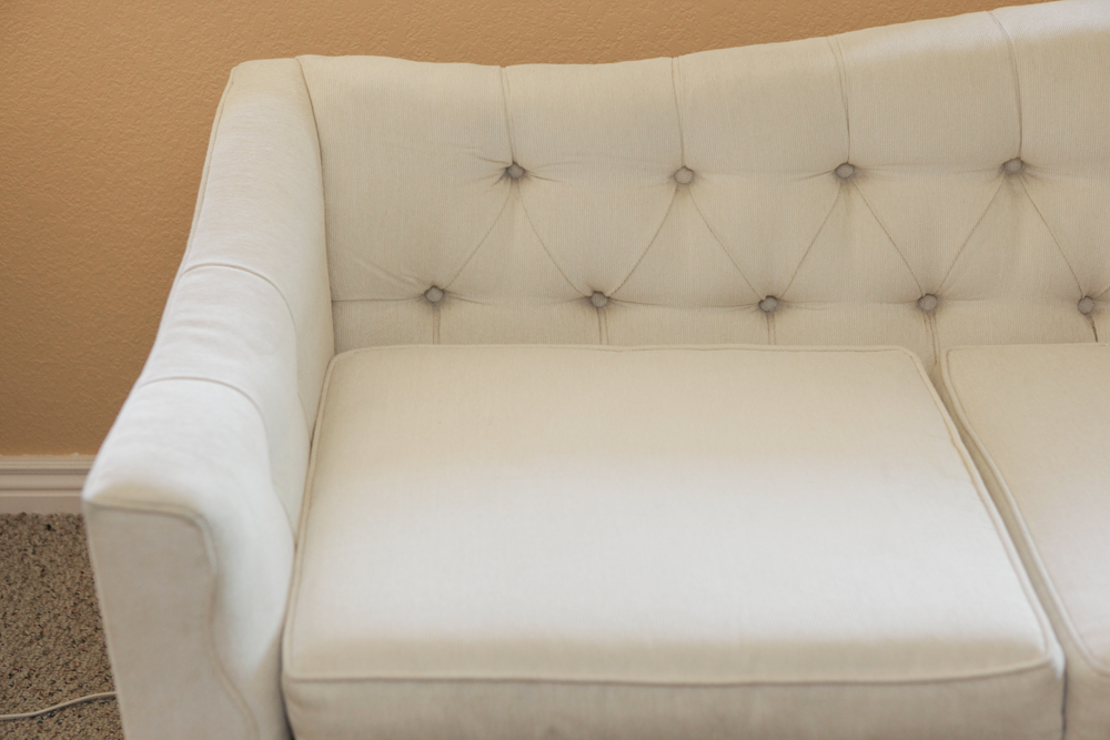 Upholstered Camel Back Sofa