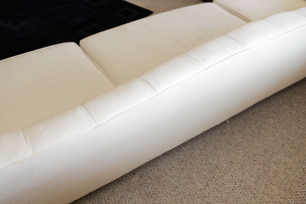 Upholstered Camel Back Sofa