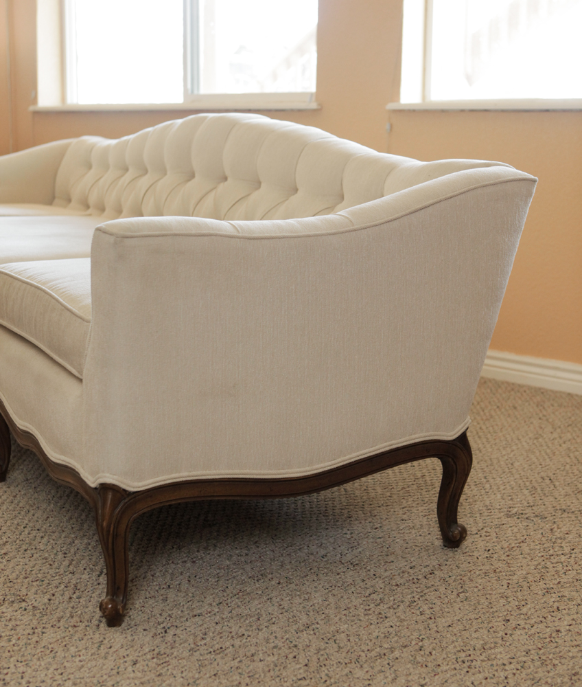 Upholstered Camel Back Sofa