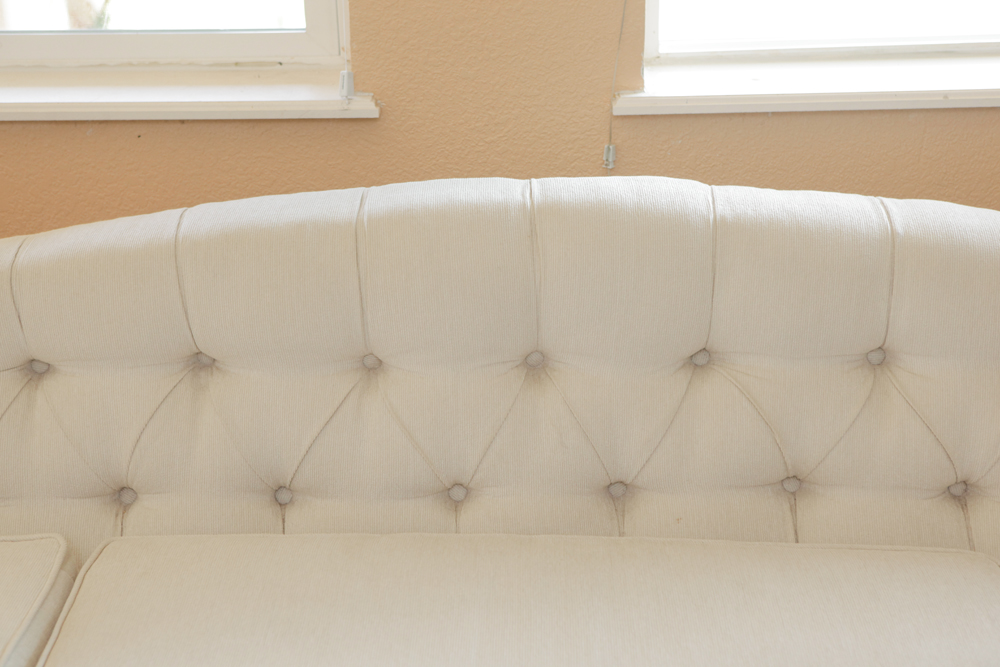 Upholstered Camel Back Sofa