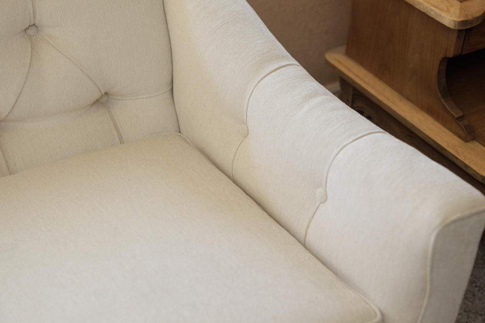 Upholstered Camel Back Sofa