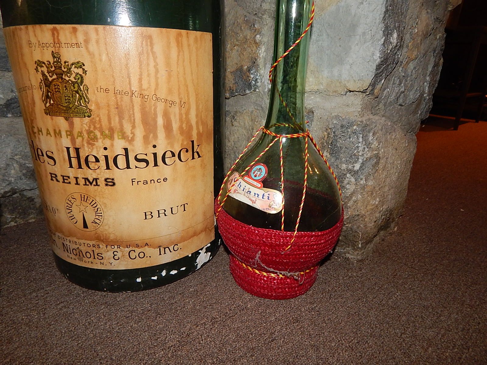 Two Glass Wine Bottles and Large  Plastic Champagne Bottle