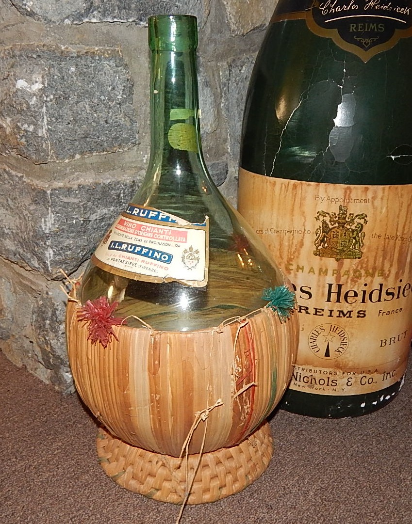 Two Glass Wine Bottles and Large  Plastic Champagne Bottle