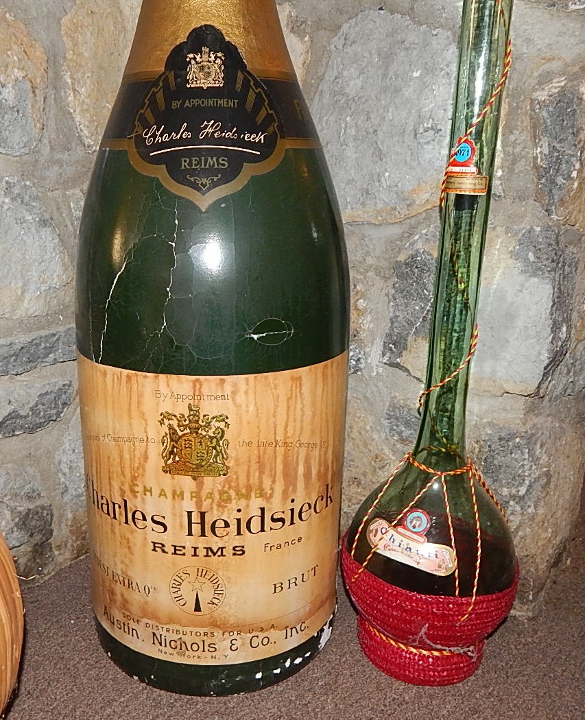 Two Glass Wine Bottles and Large  Plastic Champagne Bottle