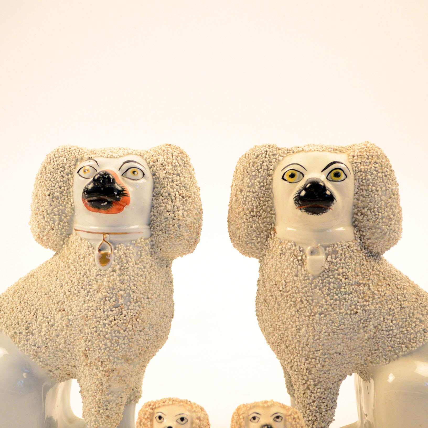 Set of Four Antique Staffordshire Poodle Figurines