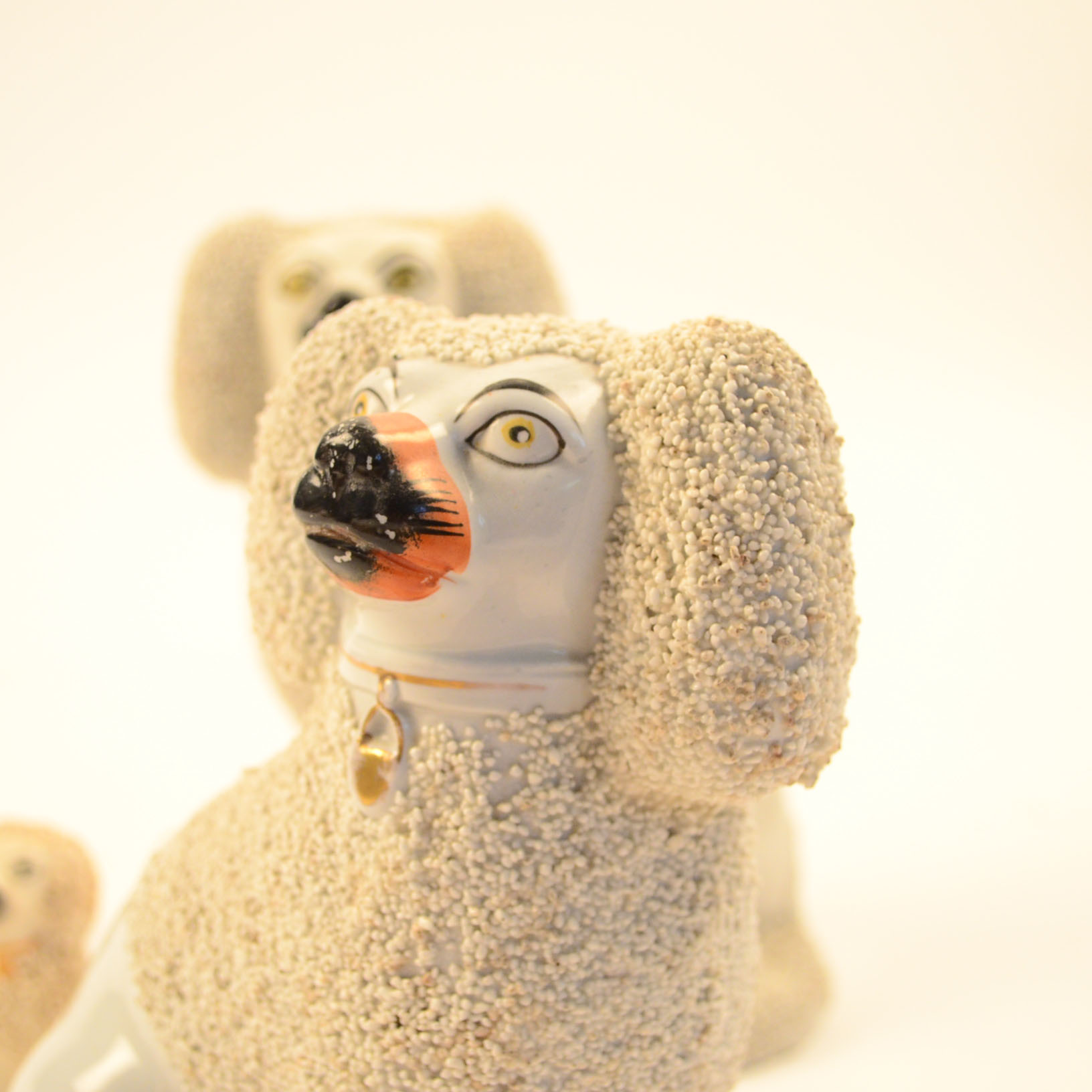 Set of Four Antique Staffordshire Poodle Figurines