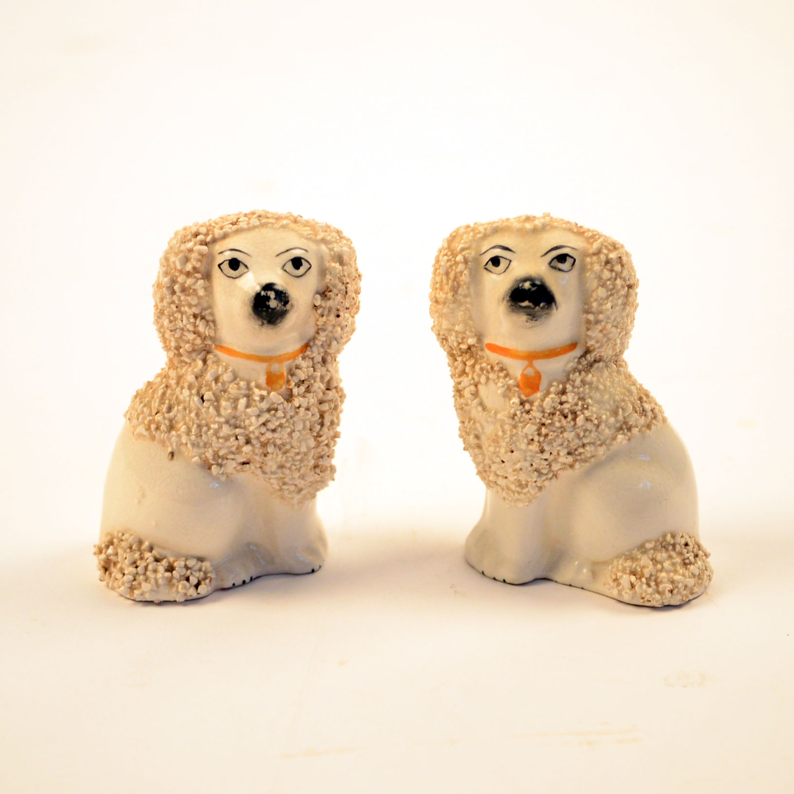 Set of Four Antique Staffordshire Poodle Figurines