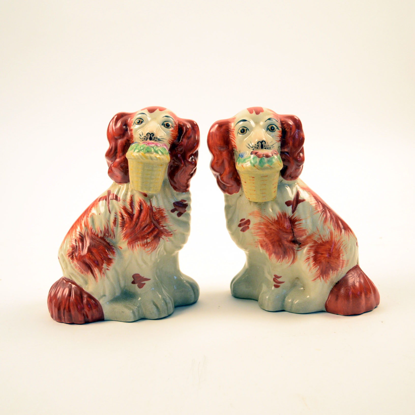 Four Antique and Reproduction Staffordshire Dog Figurines