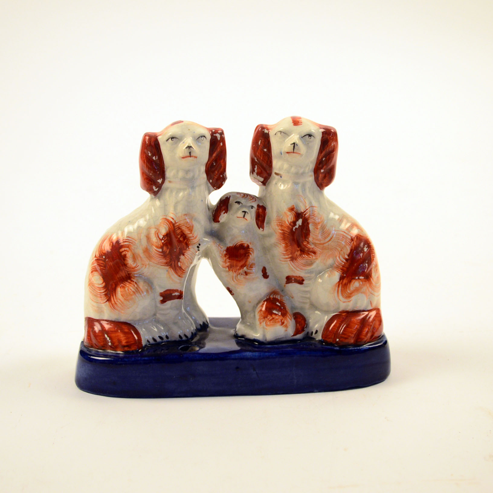 Four Antique and Reproduction Staffordshire Dog Figurines