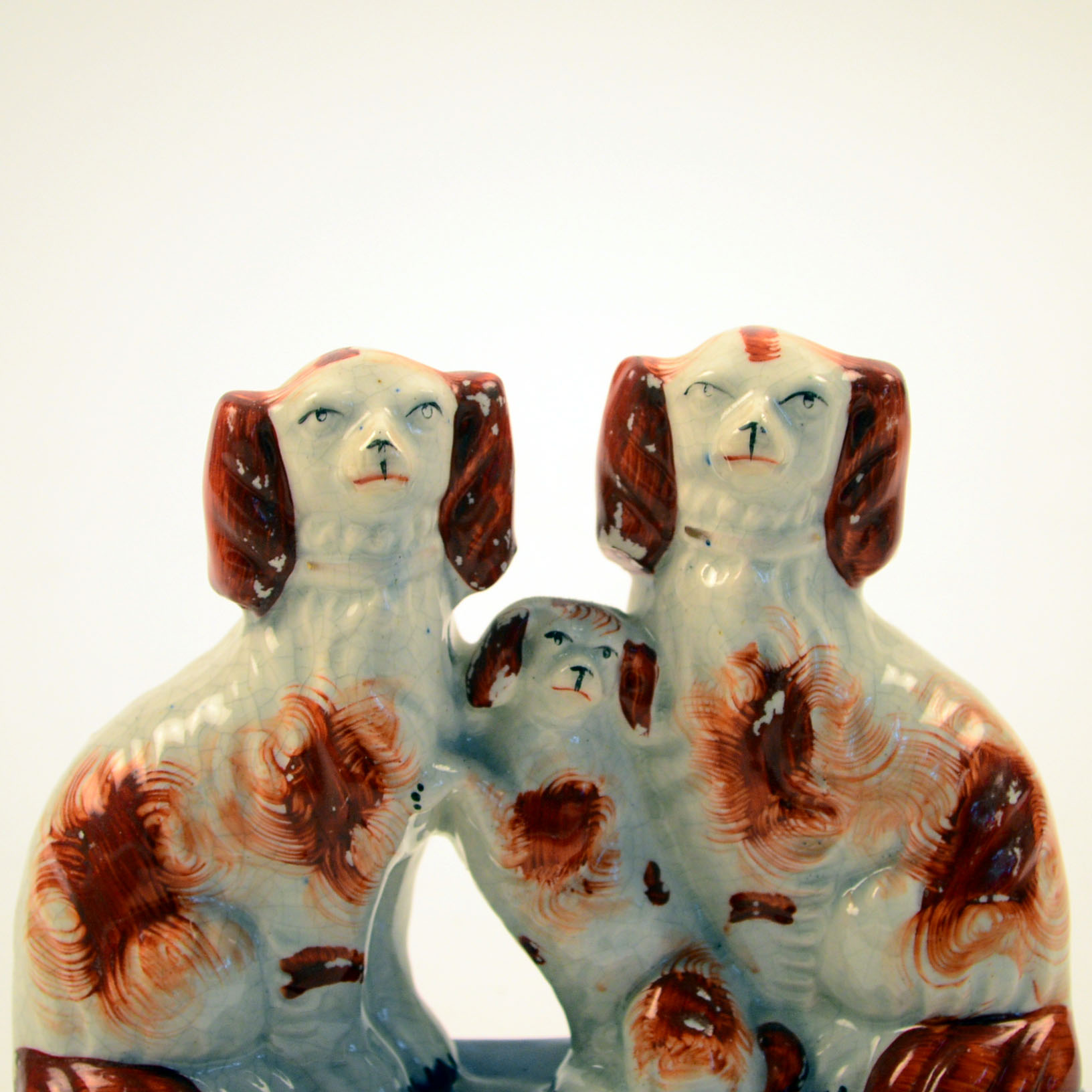 Four Antique and Reproduction Staffordshire Dog Figurines